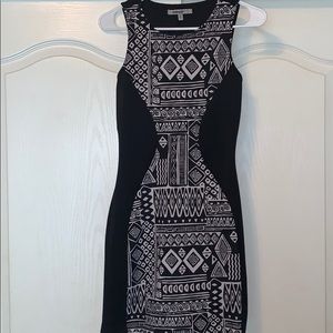 Black minidress with unique design.